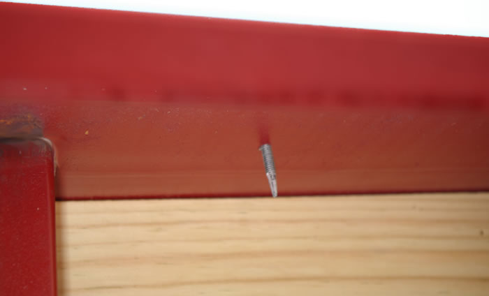 This is a view of the rectangular side rail.  The screw you see protruding fastens the light fixture on the other side.  Notice no wires or connections are exposed.  Otherwise, these connections might catch mud, snow or even brush.  All other wiring in the Red Rhino is enclosed in 1.05”OD Schedule. 40 pipe, not conduit.